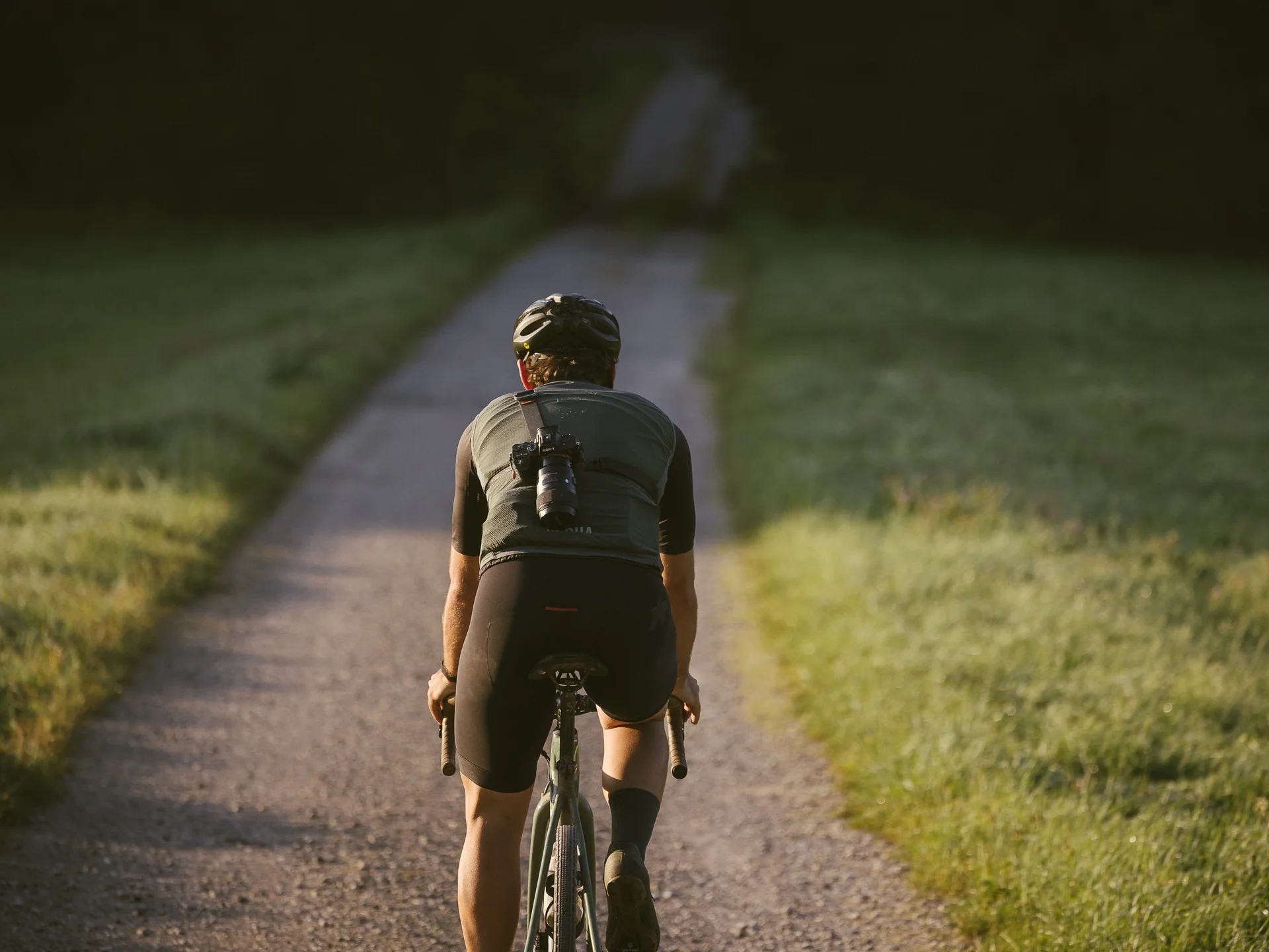 Pictures from Hotel Salnerhof Cyclist riding on a narrow path surrounded by grass in sunlight