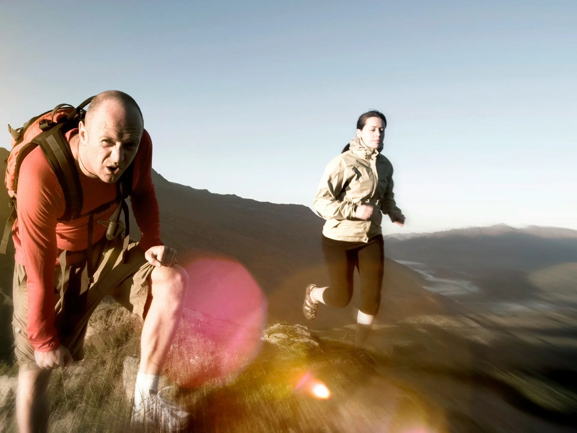 Pictures from Hotel Salnerhof Man and woman hiking on a mountain at sunrise