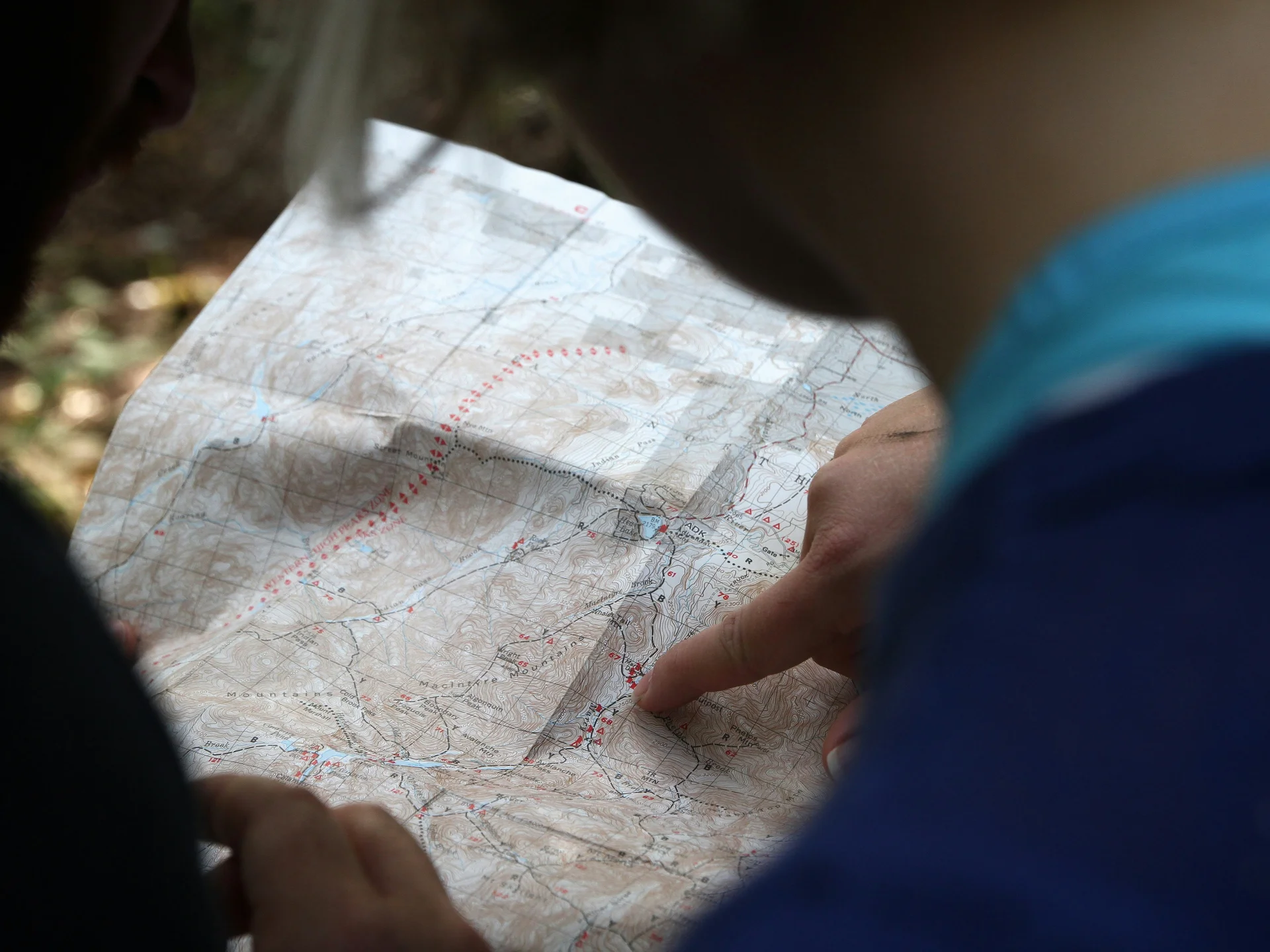 Pictures from Hotel Salnerhof Two people looking at a hiking map outdoors